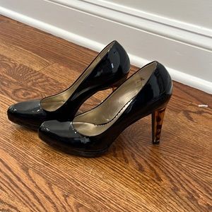 Black patent leather shoes with tortoise shell heels